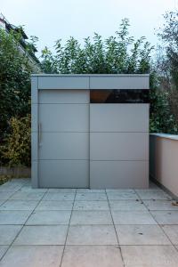 Compact elegance: the designer garden shed in timeless grey