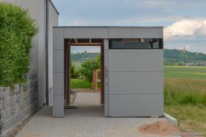 Smart connection: HPL garden shed as a passageway