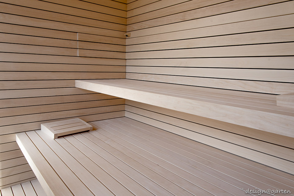Designer wellness in the garden: sauna garden shed with panoramic glazing