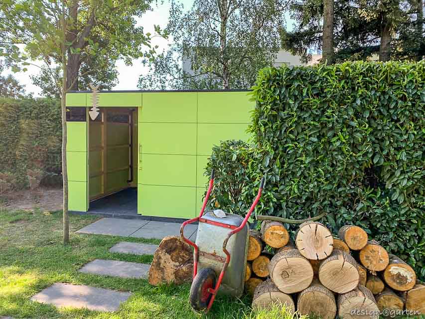 Extravagant garden shed surrounded by greenery
