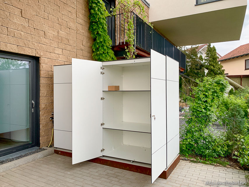 Customised weatherproof tall cabinet: elegant volume and functional terrace design