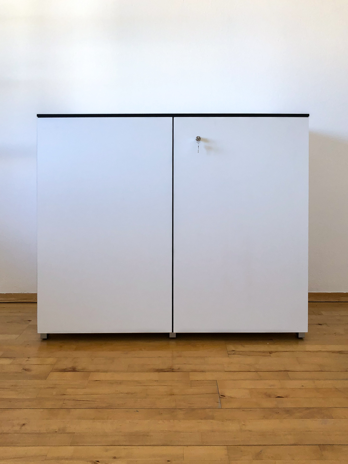 Modern white cabinet made of HPL