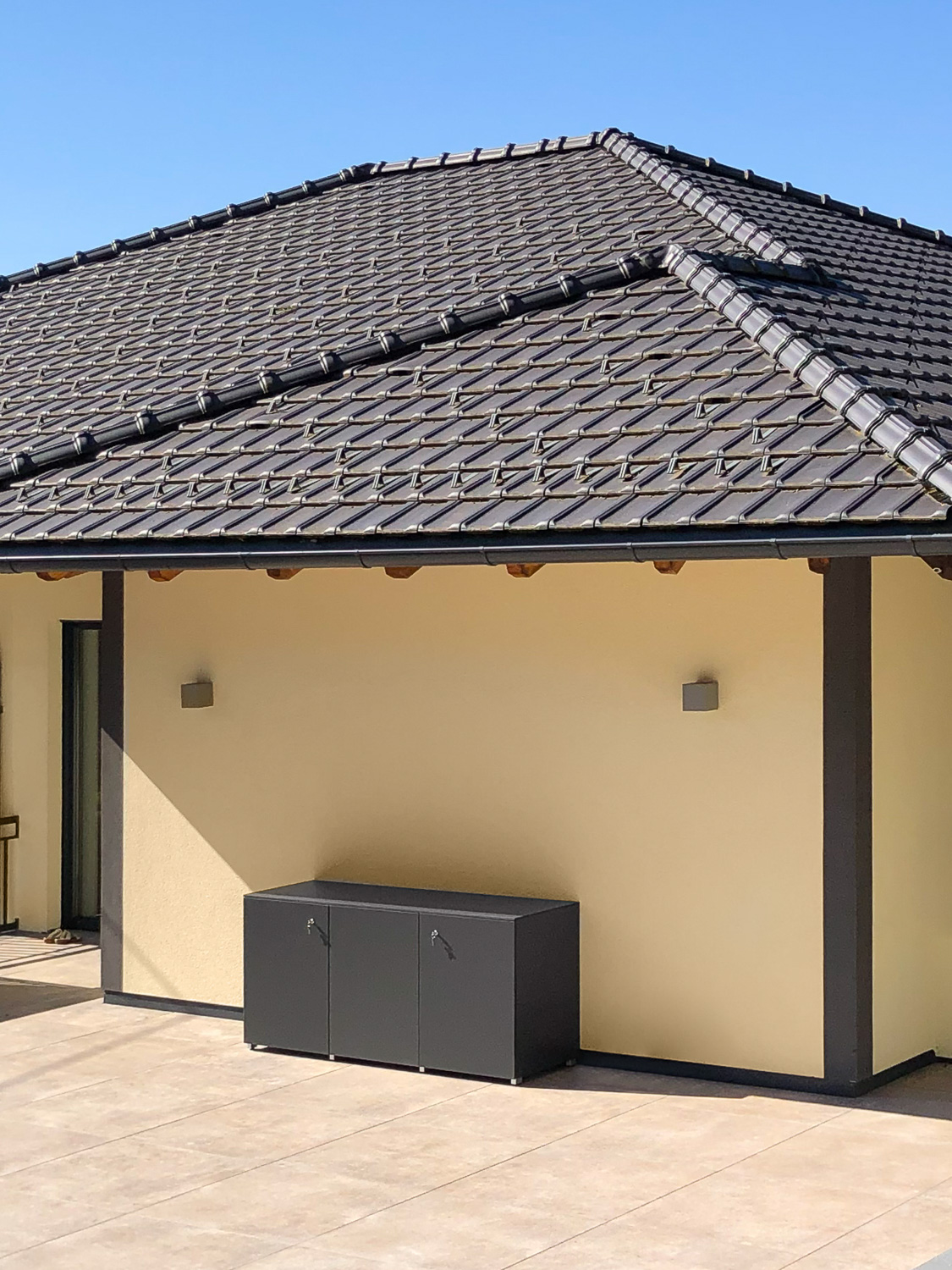 Long outdoor terrace cabinet made to measure to match roof tiles