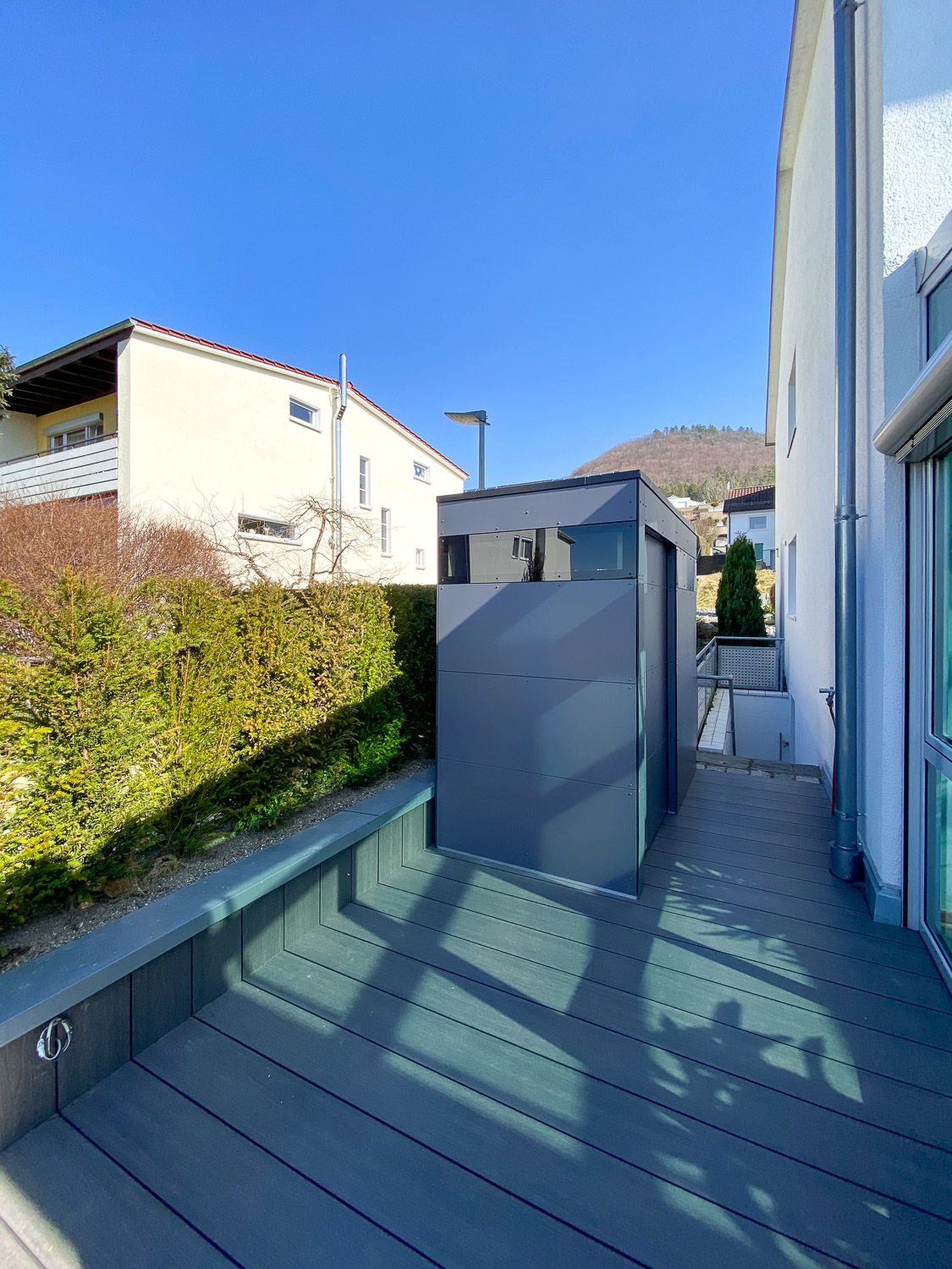 Narrow garden shed on the terrace