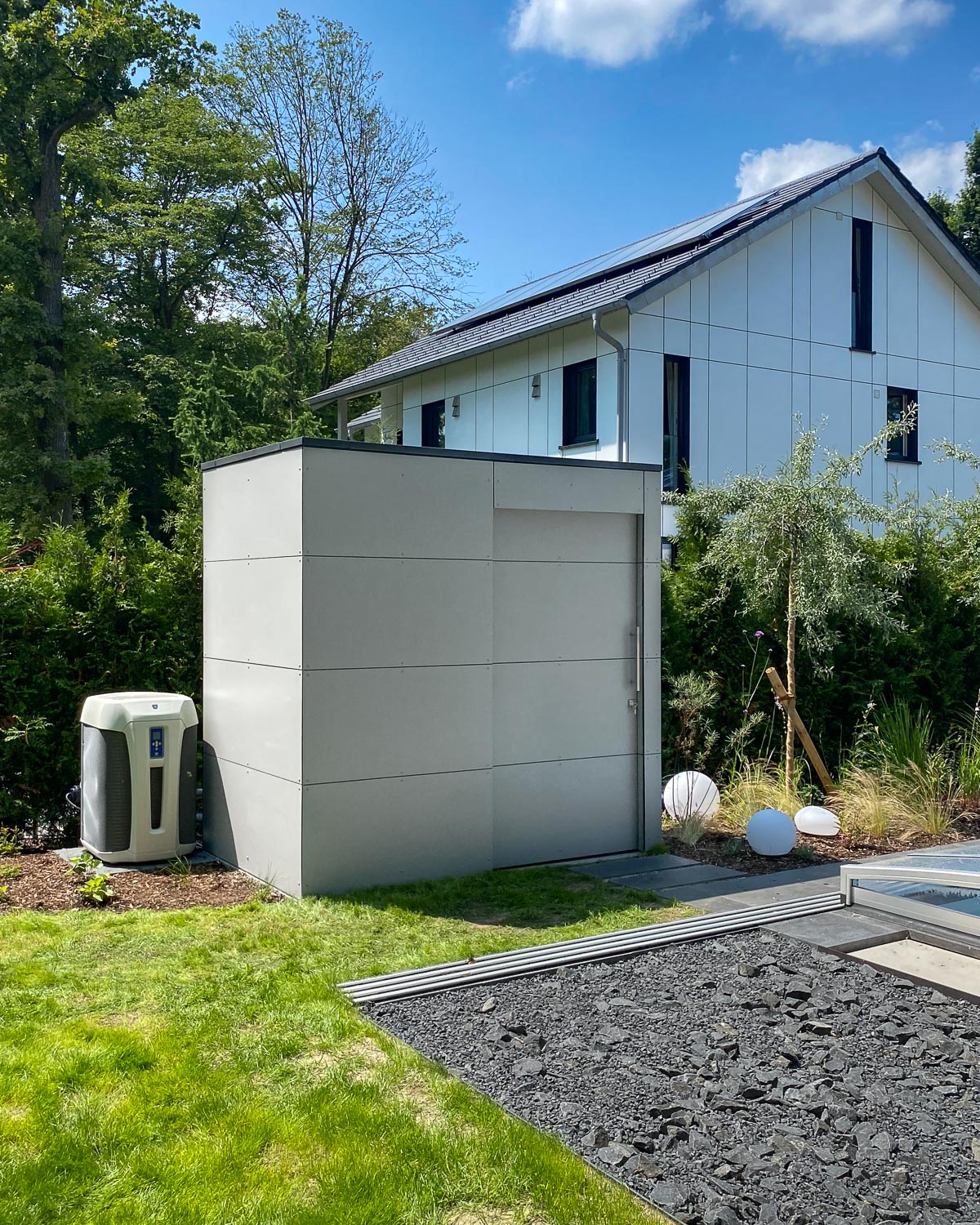 Modern pool house with sliding doors for storage space and pool equipment