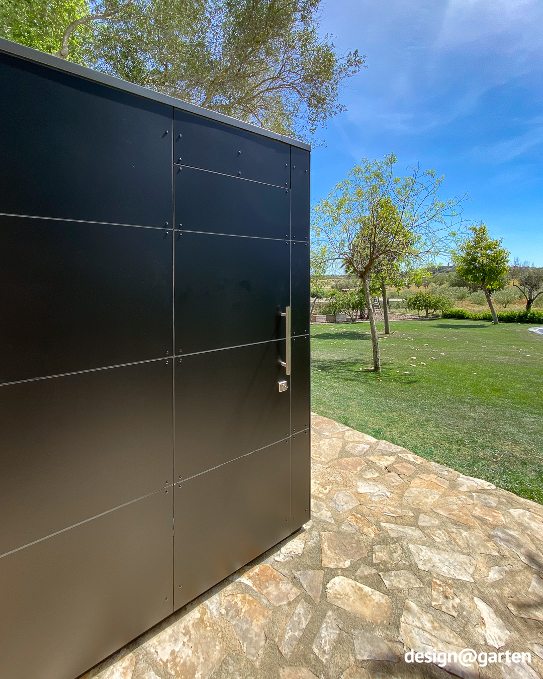 Black outdoor sauna made of HPL with panoramic glazing in Mallorca
