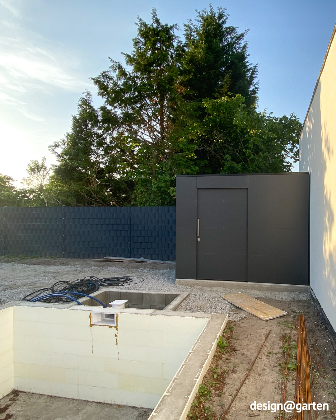 Modern pool house with sliding door made of HPL