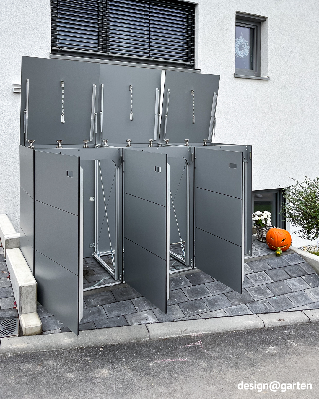 Modern 3-bin waste bin enclosure for 240-litre waste bins in grey, made from HPL