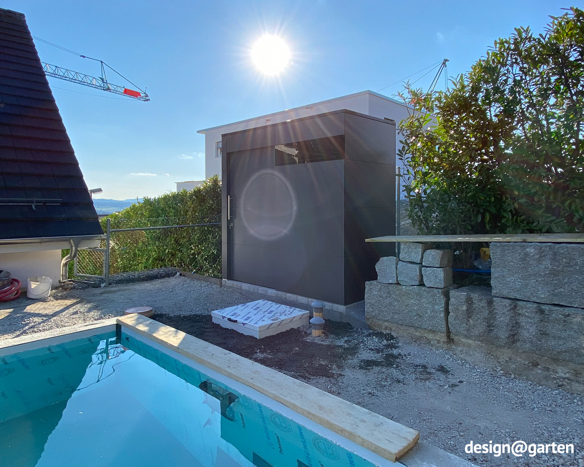 A pool equipment room in the garden as an enclosed utility room