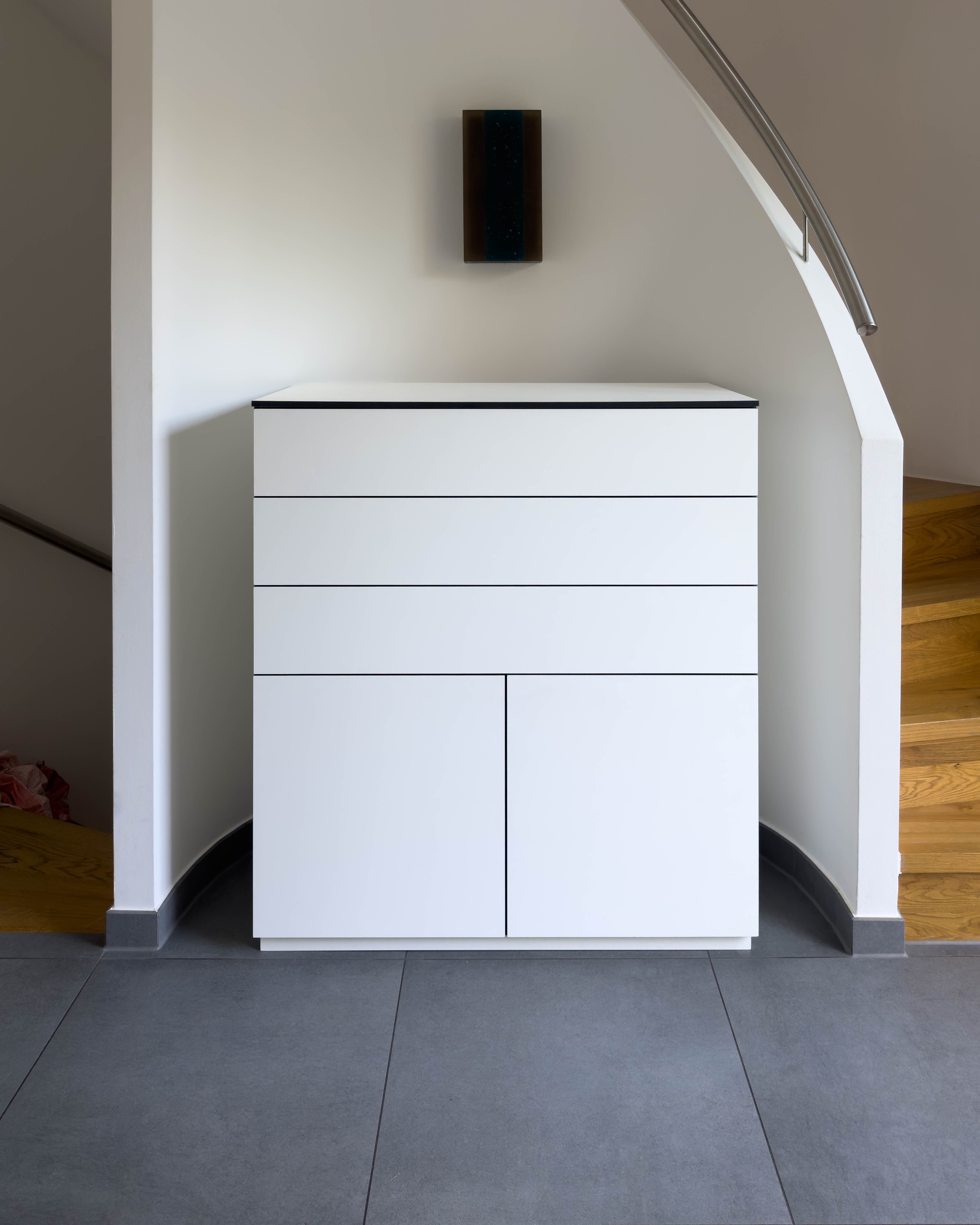 Custom-made cabinet made of HPL in white