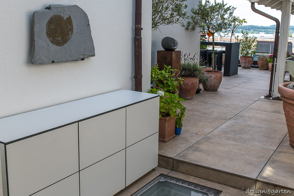 Well-designed storage duo: custom-made outdoor patio cabinets