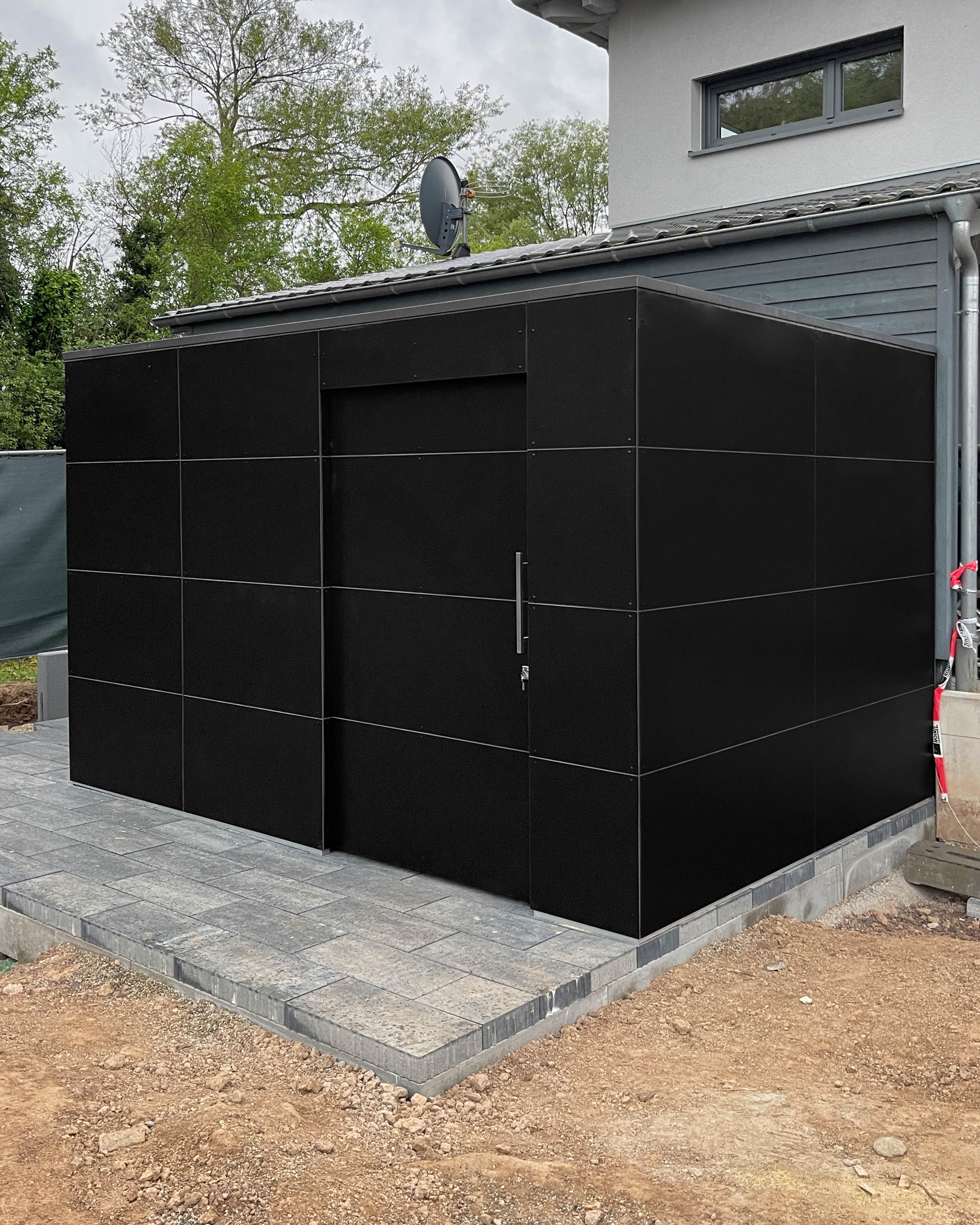 Minimalist design garden shed with wood storage