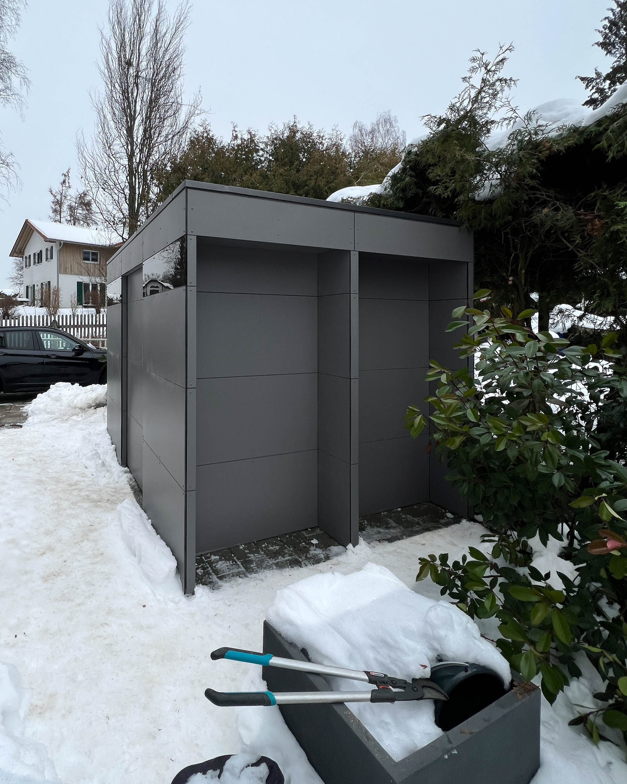 Garden shed with double wood storage