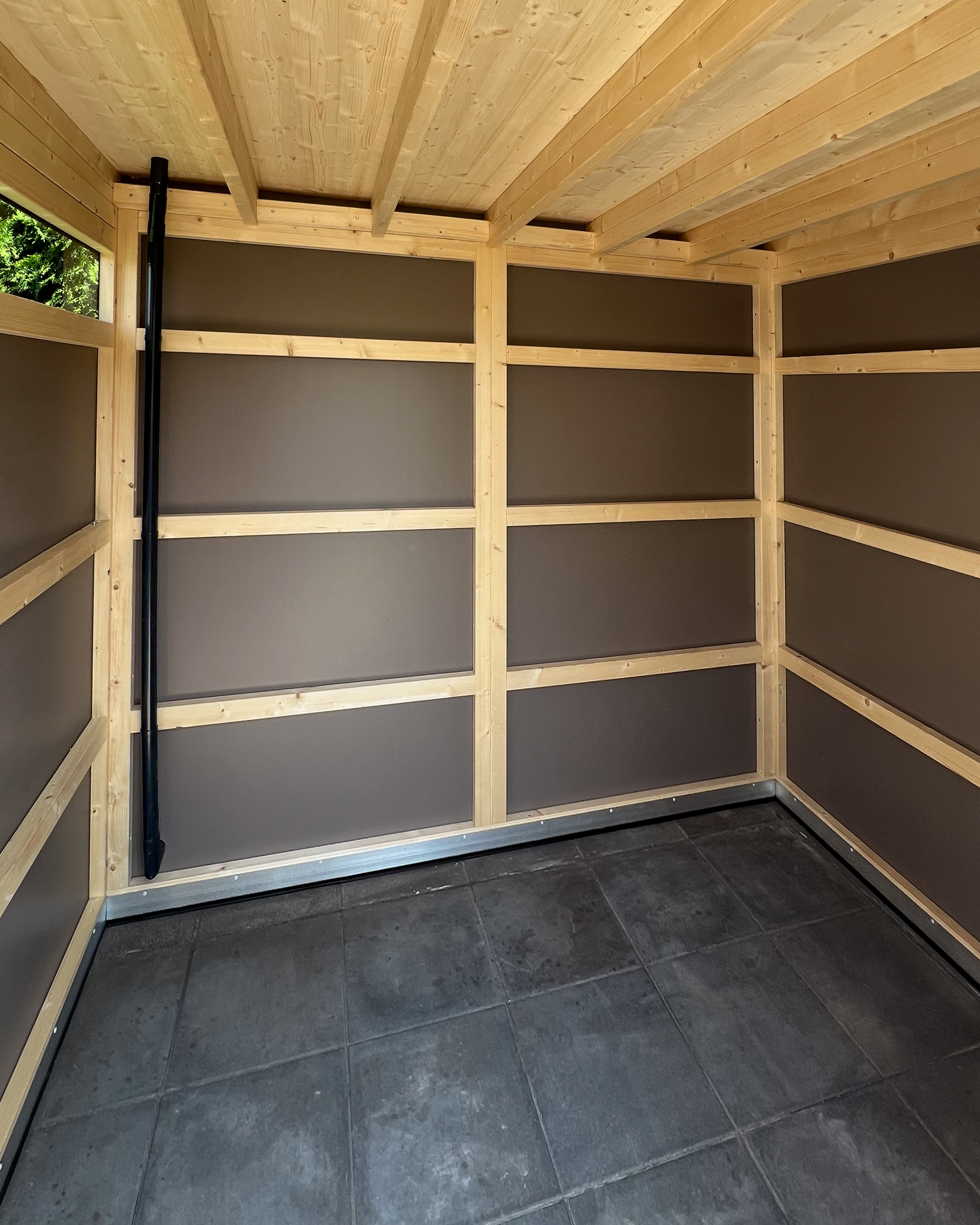 Garden shed with a sliding door and windows