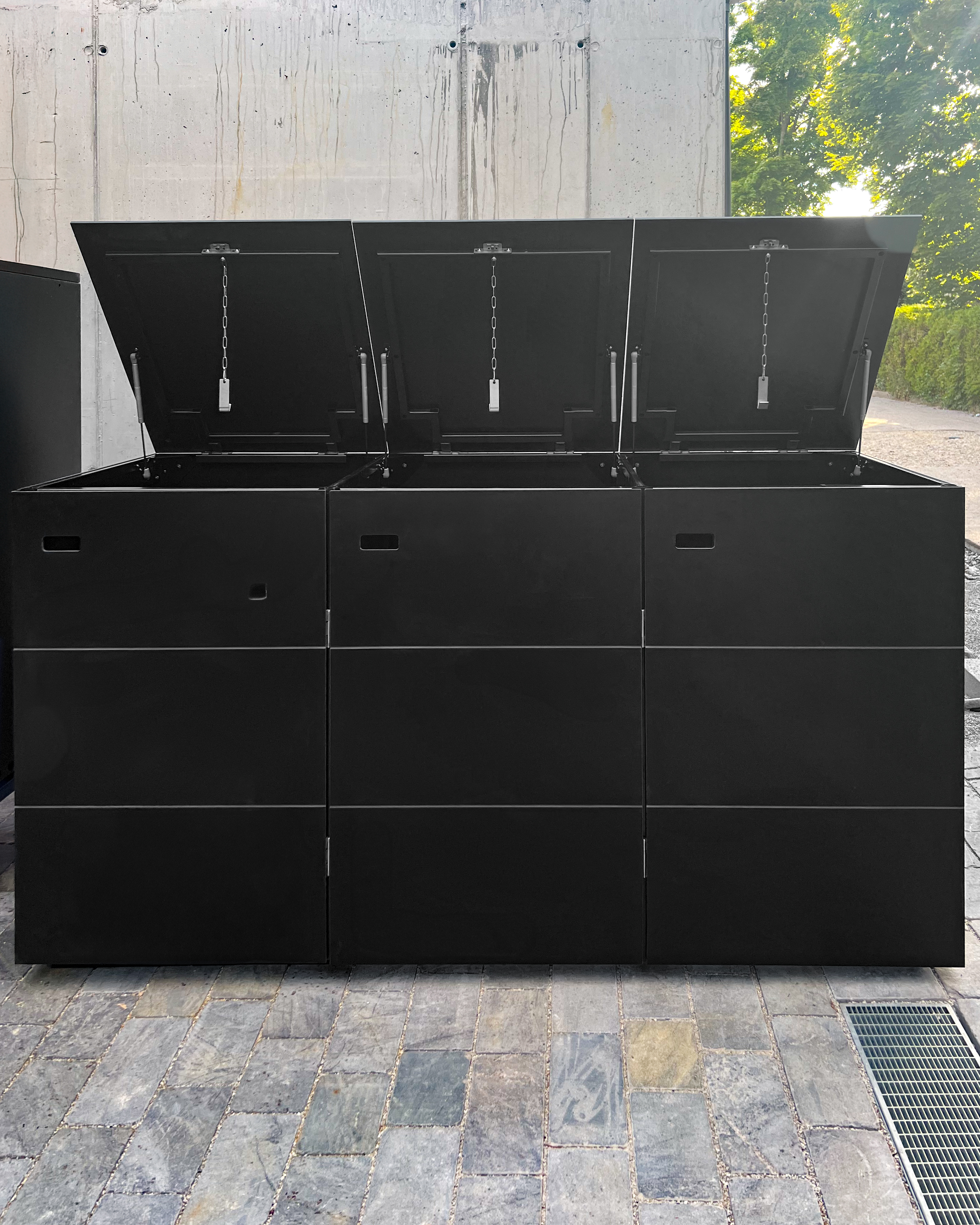 Black waste box with integrated letterbox