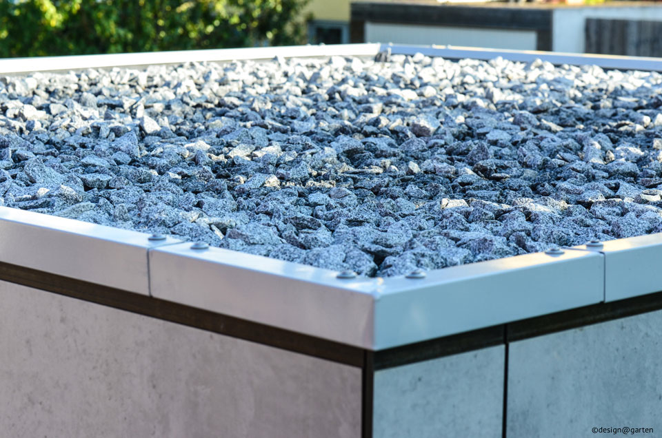 Minimalismo atemporal: la moderna caseta de jardín con un elegante acabado de hormigón.