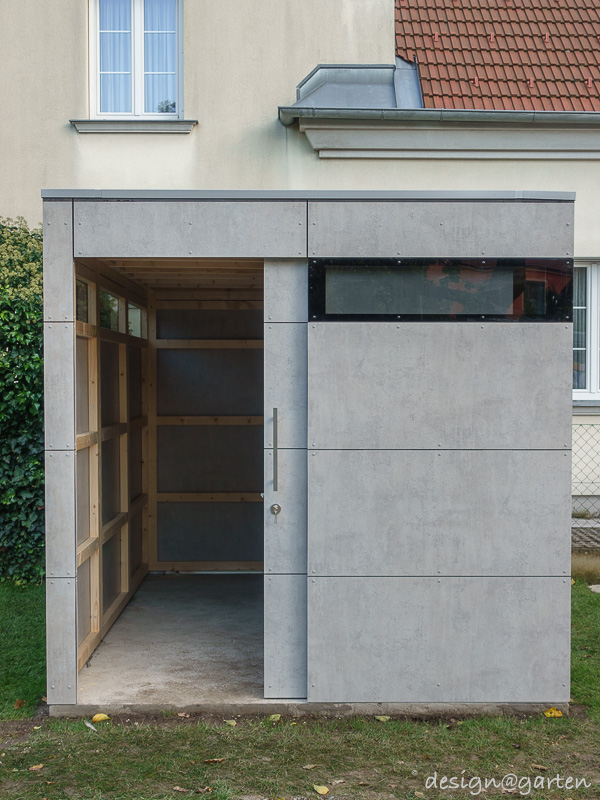 Charme moderne dans le jardin : l'abri de jardin design à l'aspect béton apparent