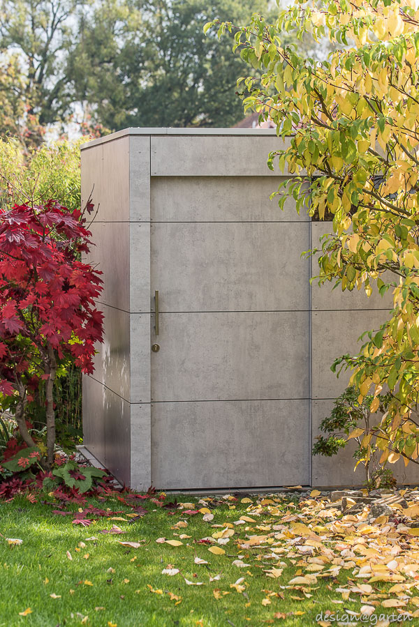 Minimalisme intemporel : l'abri de jardin moderne au look béton raffiné