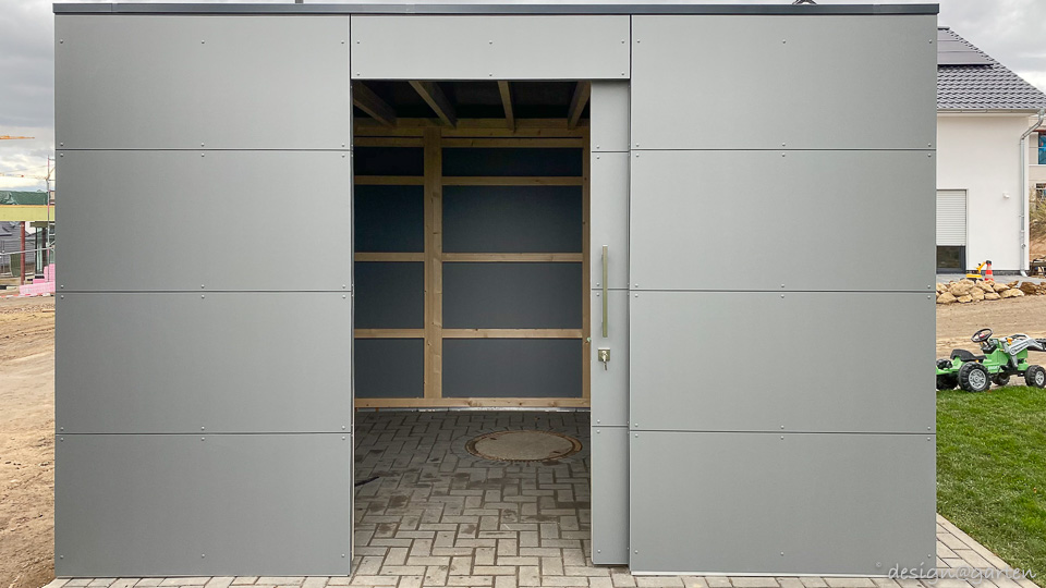 Abri de jardin épuré pour une architecture moderne : efficacité et protection contre les intempéries