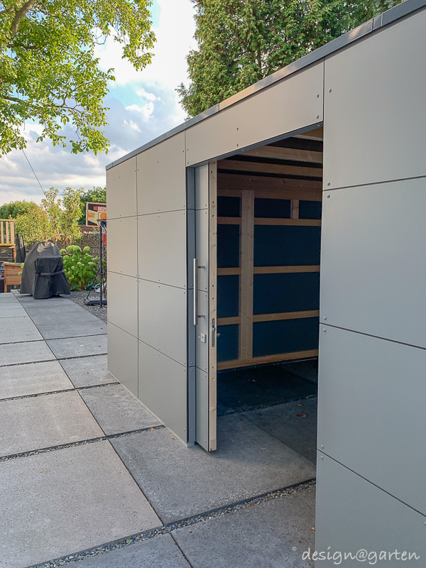 Abri de jardin avec rangement pour le bois : une solution architecturale dans le style Bauhaus